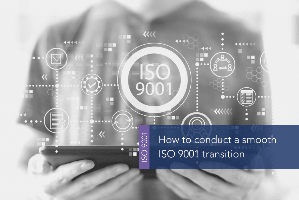How to conduct a smooth ISO 9001 transition MAIN A person holding a tablet