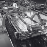 A group of robotic arms on a conveyor belt