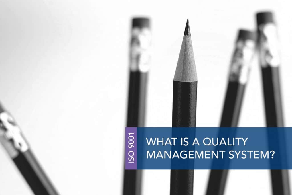 A pointy, sharpened pencil pointing up with four pencils in the background pointing down