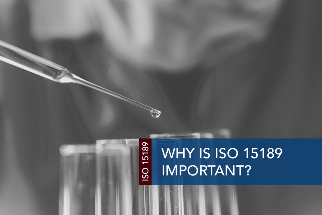 Black and white image of test tubes and a dropper filling them with clear liquid